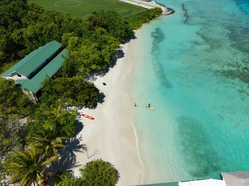 Belmar Beach guesthouse on its beach, seen from above the lagoon